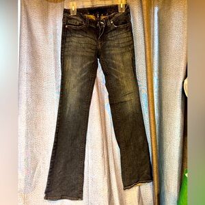 Dark blue distressed bootcut jeans